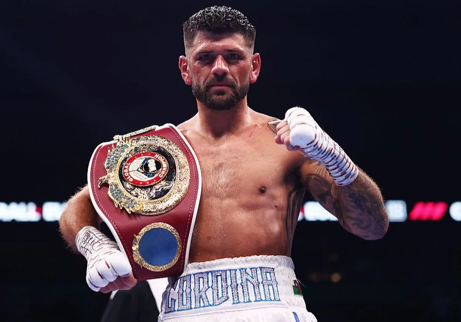 Joe Cordina in the ring wearing his world championship belt